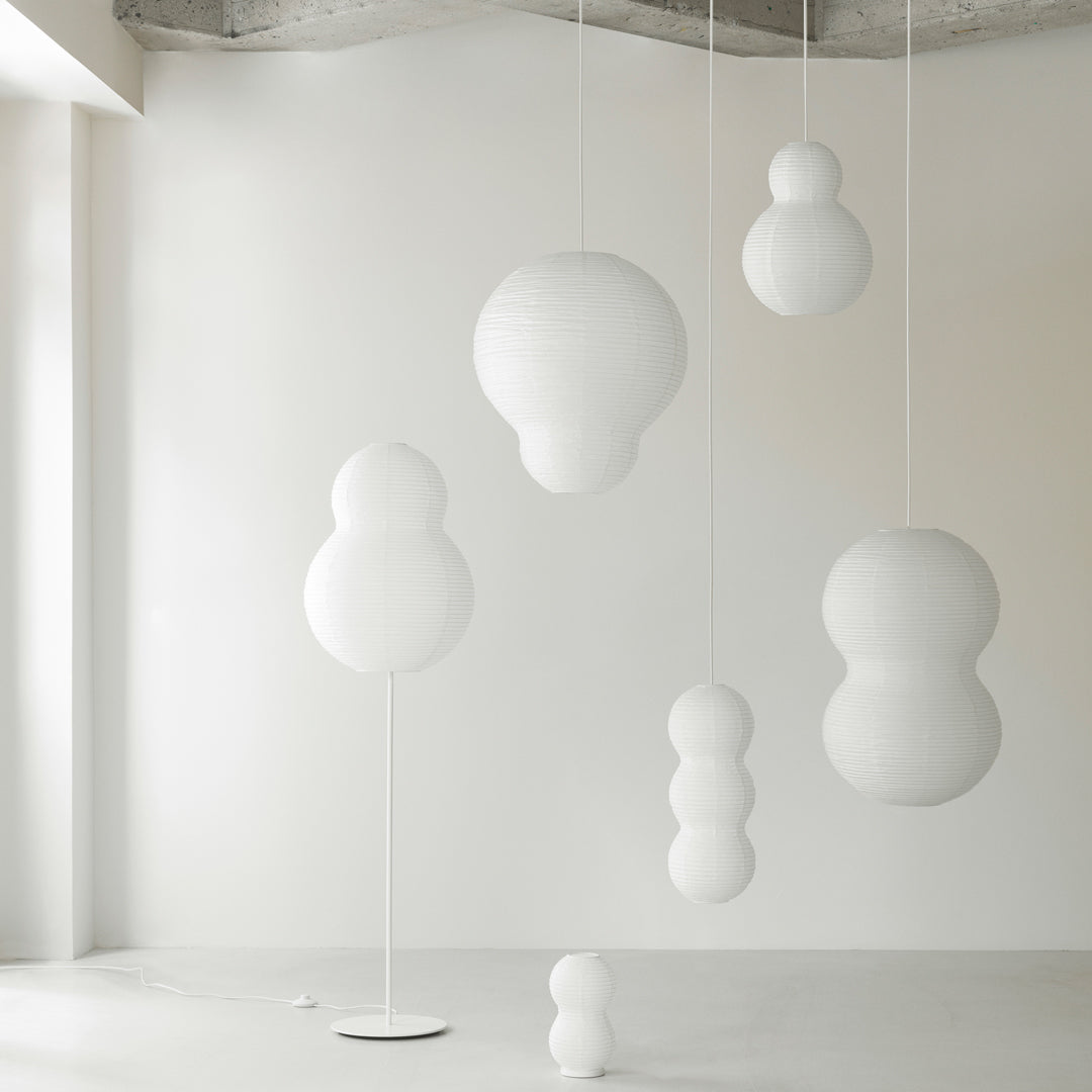 White modern pendant lights with various bubble shapes, adding a minimalist touch to interior decor.