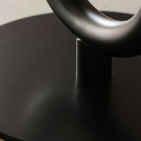 Sleek black base with a smooth metallic gray loop accent, creating a modern, minimalist design.