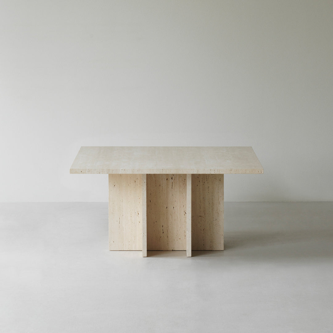 Light wood table with a smooth, natural finish and minimalist design, featuring clean lines and a neutral color palette.