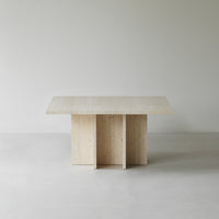 Light wood table with a smooth, natural finish and minimalist design, featuring clean lines and a neutral color palette.