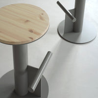 Light wood tabletop with natural grain, paired with sleek gray metal base and accents. Modern minimalist design.
