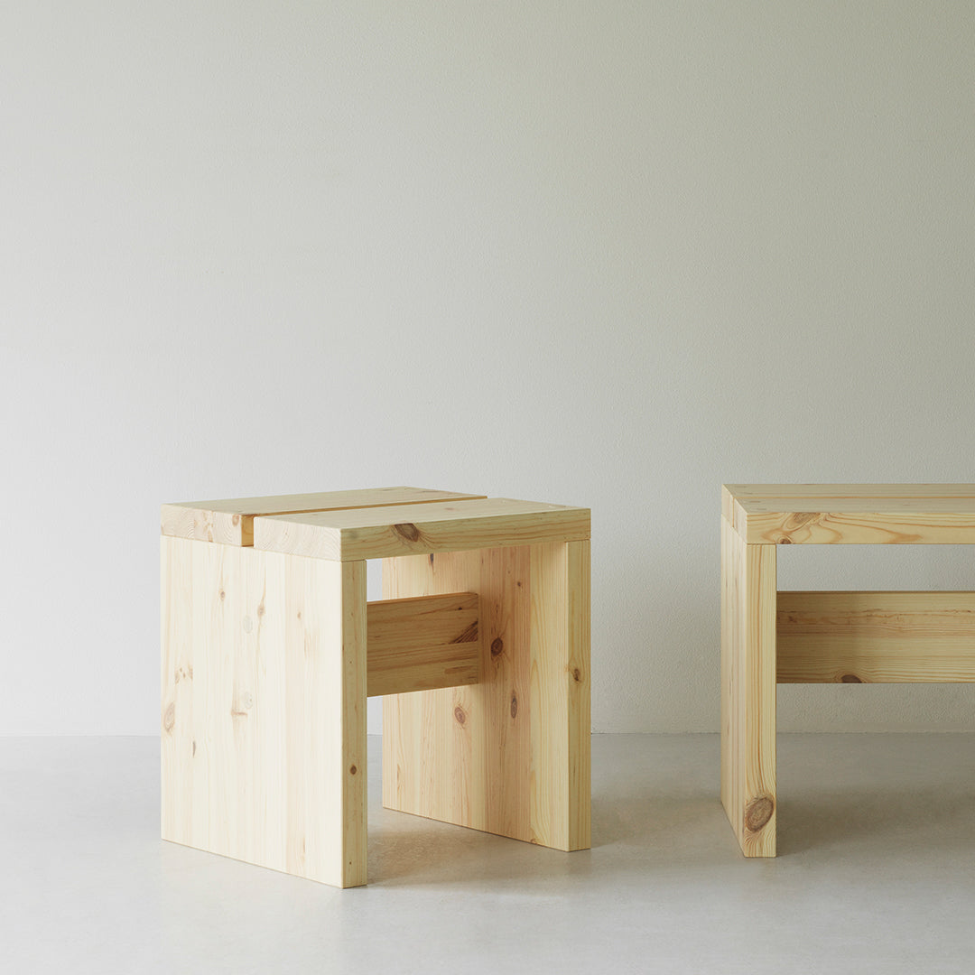 Natural pine wood stools with a light, unfinished look and simple geometric design. Perfect for minimalist decor.