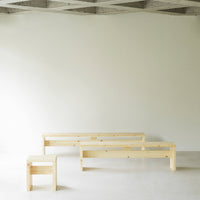 "Light natural wood benches in minimalist design, showcasing smooth grains and clean lines against a neutral backdrop."