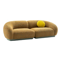 Textured orange and yellow two-tone sofa with a round yellow cushion, featuring a modern, curvy design.