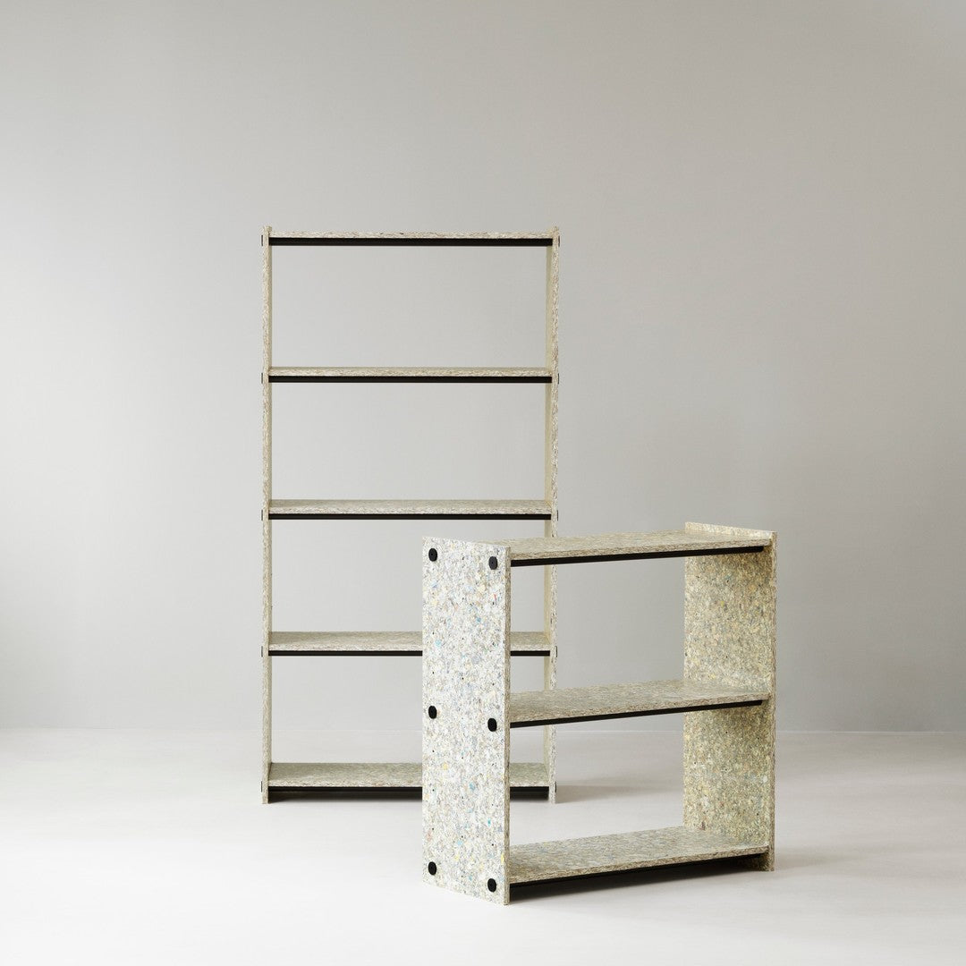Two modern shelves featuring a light speckled pattern with a neutral color palette and sleek black accents.