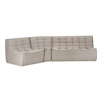 Beige tufted sectional sofa with a modern design and soft fabric texture. Ideal for contemporary living spaces.