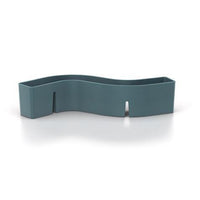 "Wavy teal silicone organizer with a sleek, solid color and minimalist design."