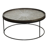 Round coffee table with a patterned white top and dark metal base, featuring a sunburst design.