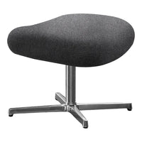 Gray upholstered stool with a smooth, rounded shape and sleek silver base, perfect for modern decor.