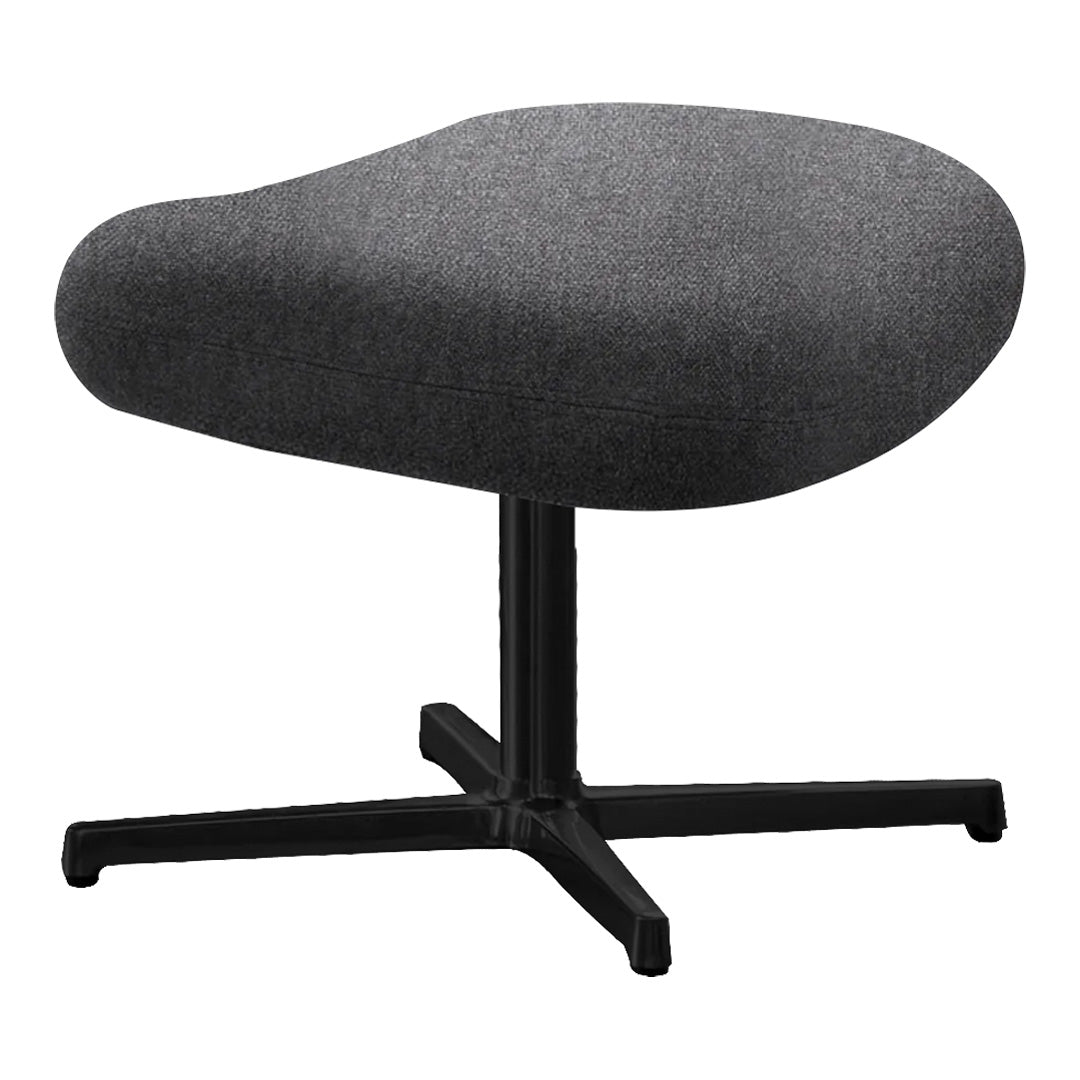 "Gray upholstered chair with a smooth, contoured design and a matte black base."