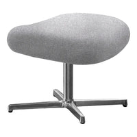 Stylish gray upholstered ottoman with a smooth fabric surface and a sleek silver metal base.
