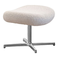 Cream-colored, textured stool with a soft, fluffy surface and sleek silver base. Perfect for modern decor.