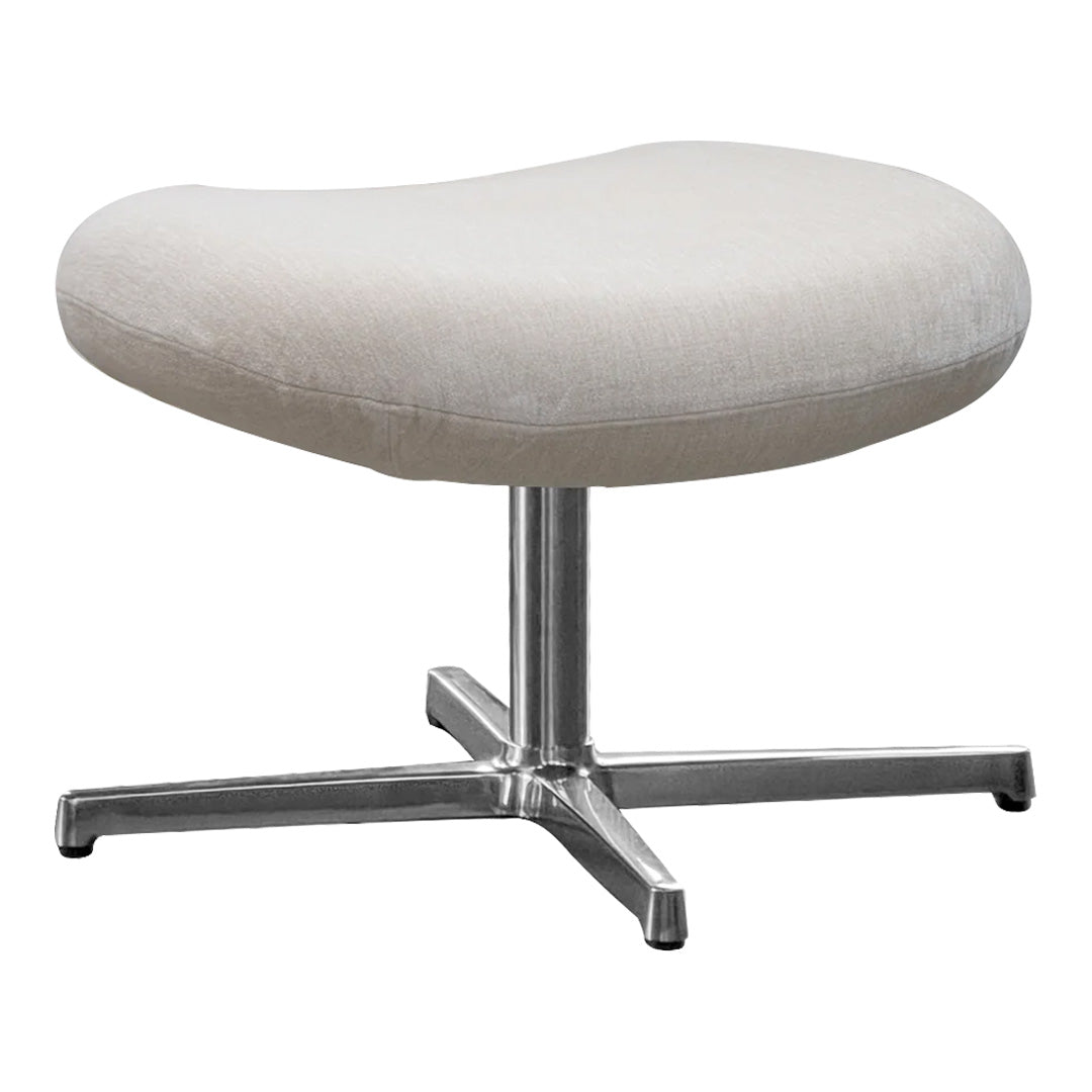 Light beige upholstered ottoman with a smooth, curved shape and a sleek chrome base.