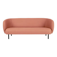 Peach-colored, sleek sofa with a minimalist design and smooth, curved upholstery.