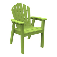 Vibrant green adirondack chair with classic slatted back design, perfect for outdoor relaxation.