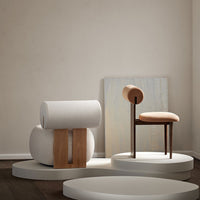 Modern furniture in muted tones: soft beige, light gray, and warm wood accents with sleek, minimalist design.