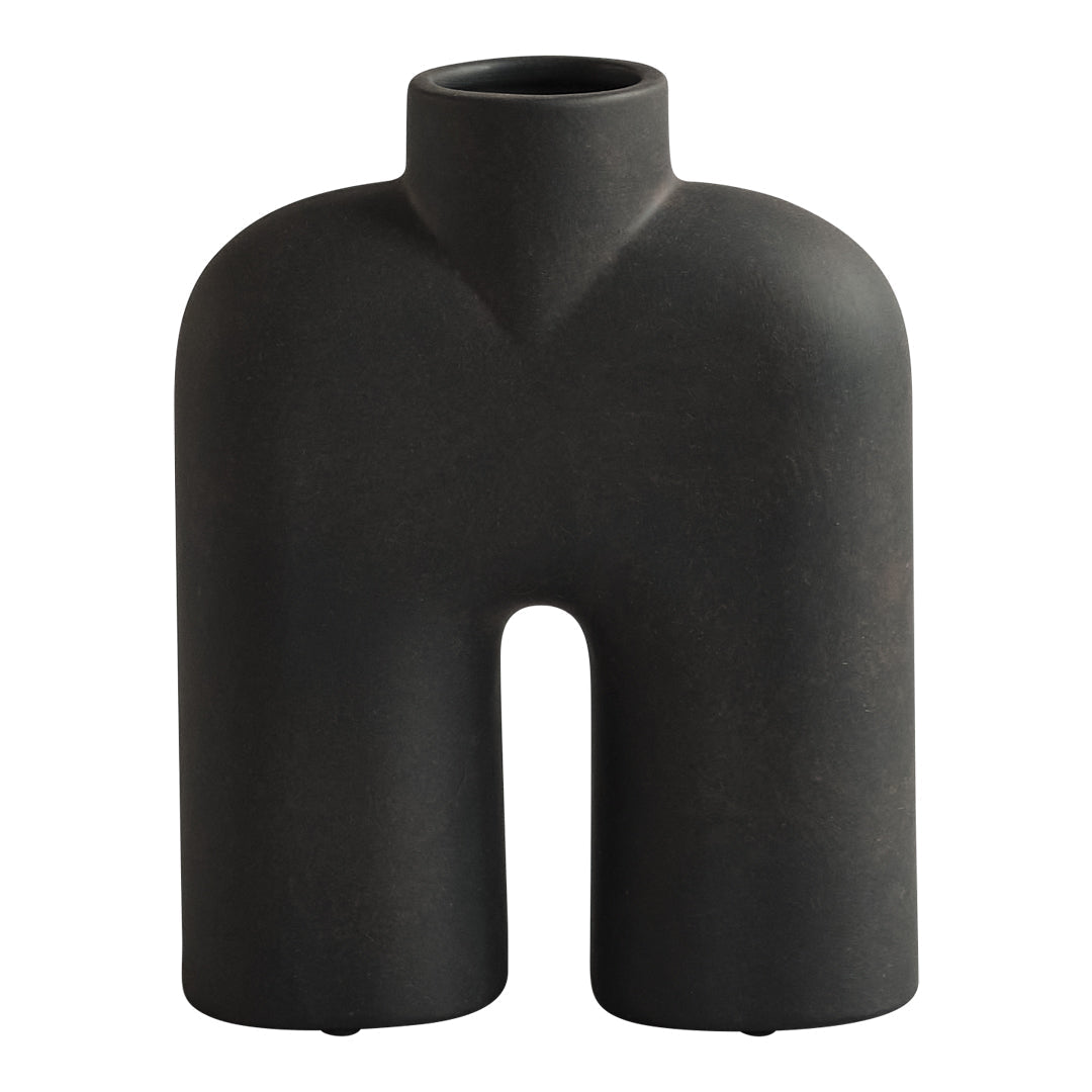 Black abstract vase with a unique human-like silhouette and a matte finish, perfect for modern decor.