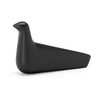 Smooth black bird-shaped decorative object with minimalist design and matte finish. Perfect for modern decor.