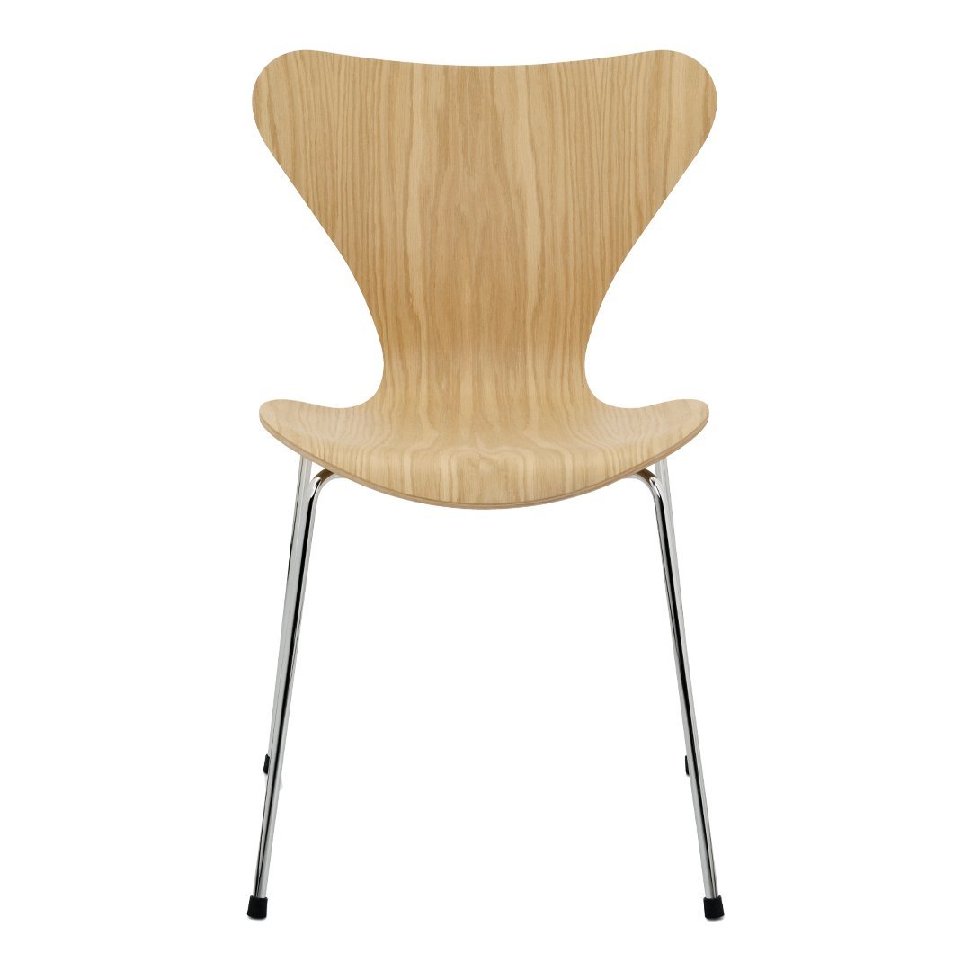 Natural wood finish chair with a smooth, curved silhouette and shiny chrome legs. Modern, minimalist design.