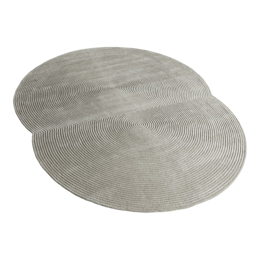 Light gray placemat set featuring intricate concentric circle patterns for a modern table setting.