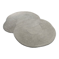 Gray ribbed area rug set featuring organic, flowing shapes and concentric circle patterns for modern decor.