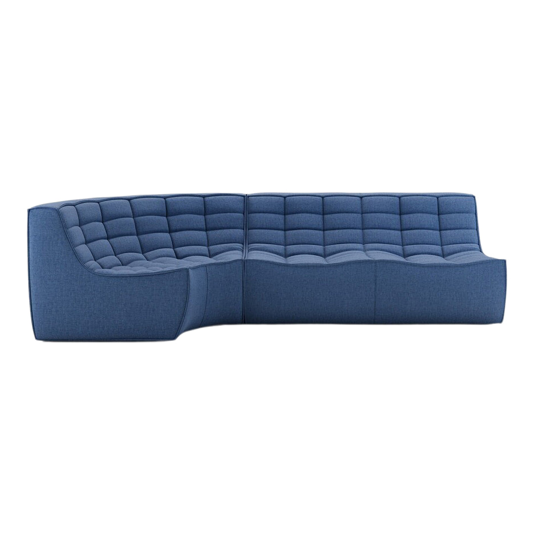 Modern blue sectional sofa with a quilted pattern, showcasing rich navy hues and textured fabric for a stylish look.