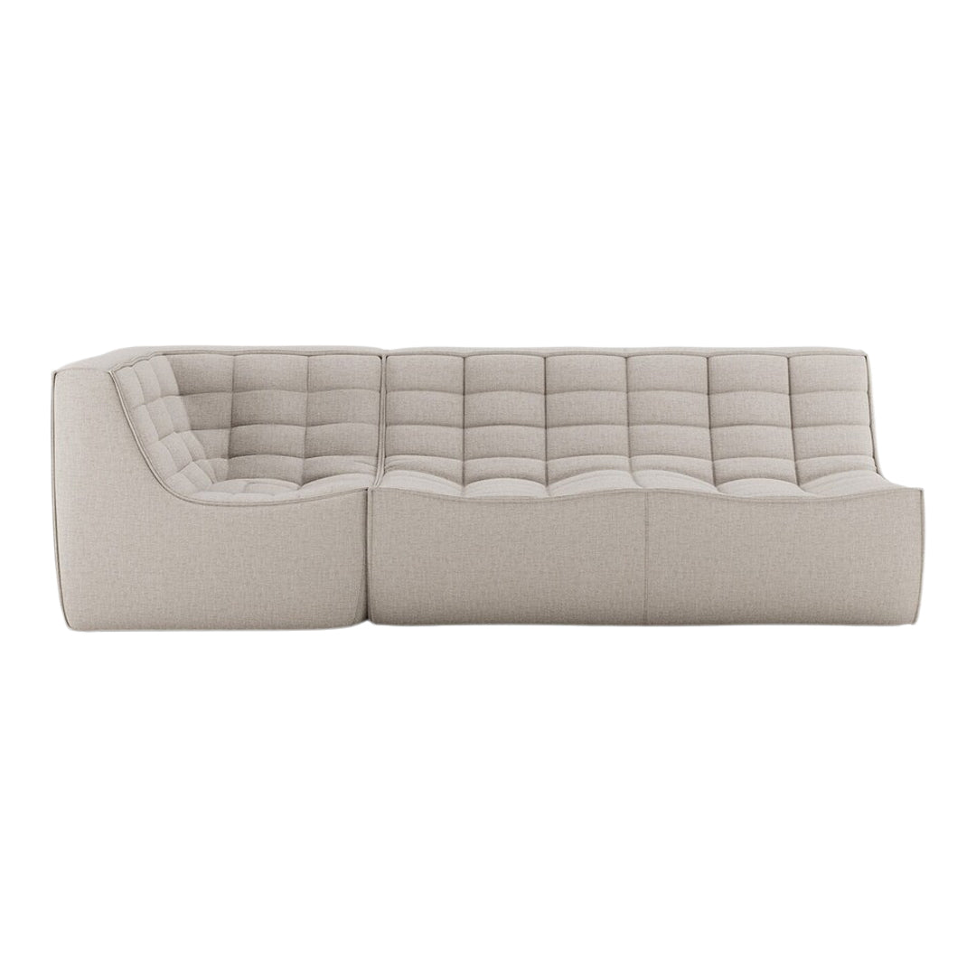 Beige tufted sofa in a contemporary design, featuring a smooth, textured fabric with a minimalist aesthetic.