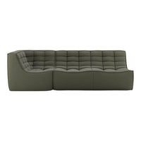 Contemporary green sofa with a quilted pattern, featuring a sleek, modern design and textured fabric.