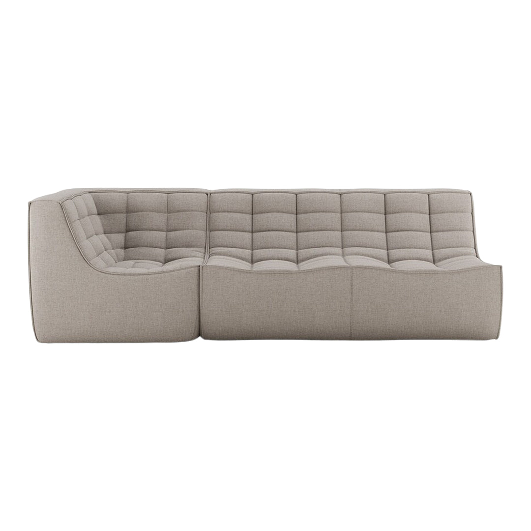 Contemporary beige sectional sofa with a quilted pattern and smooth fabric texture for stylish living spaces.
