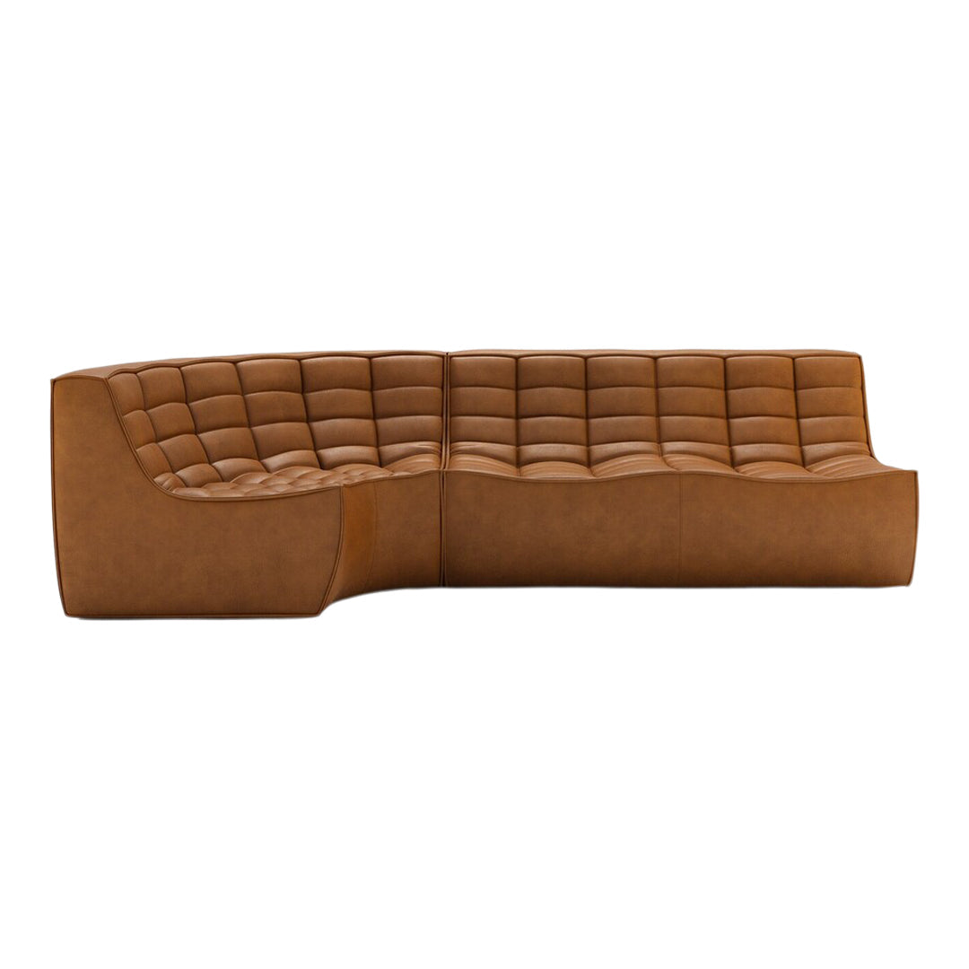 Brown curved sofa with tufted texture, featuring a warm, rich color and smooth, modern finish.