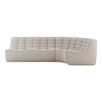 Beige tufted sectional sofa with soft, textured fabric and smooth, curved design for modern interiors.