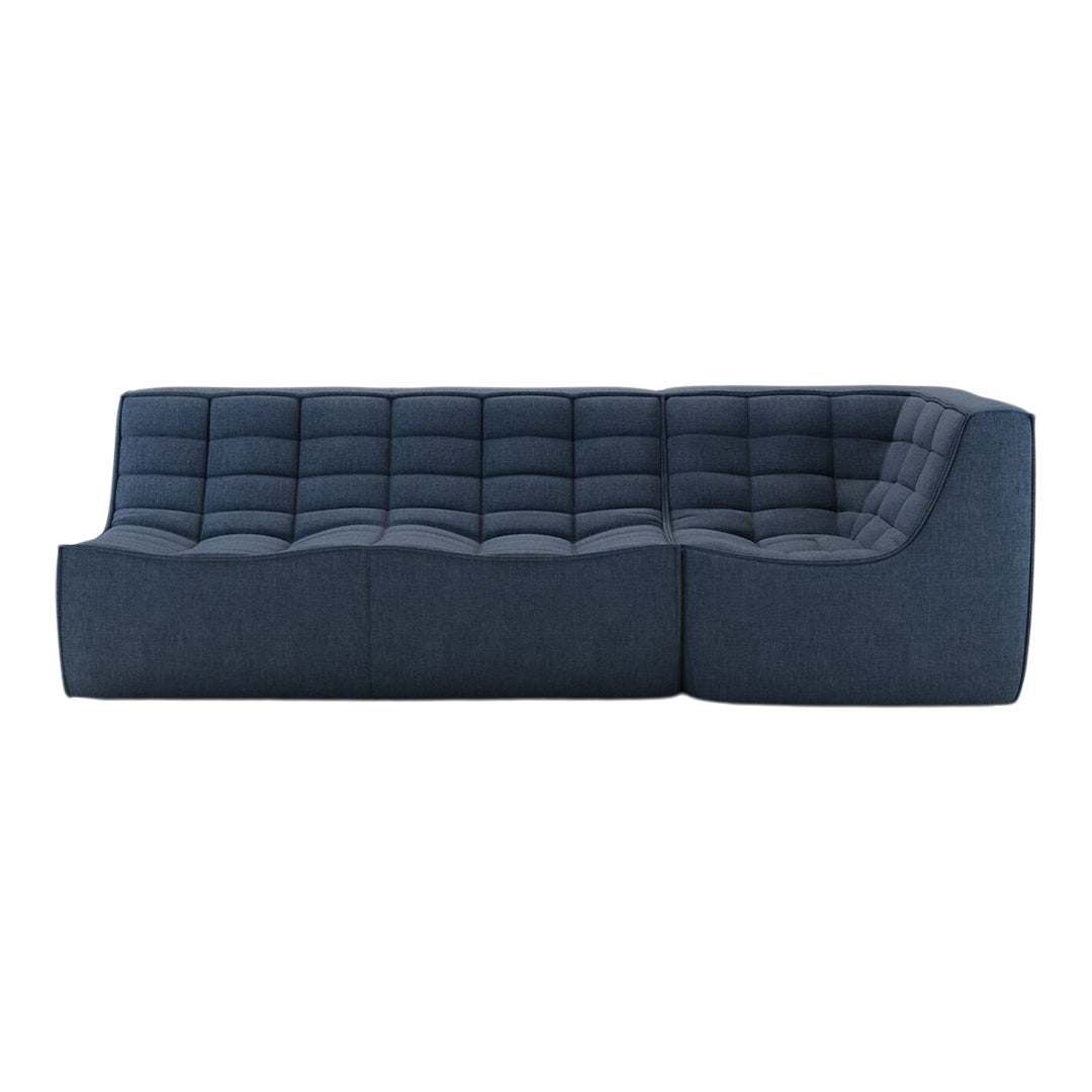 "Contemporary dark blue sofa with tufted pattern and sleek, modern design."