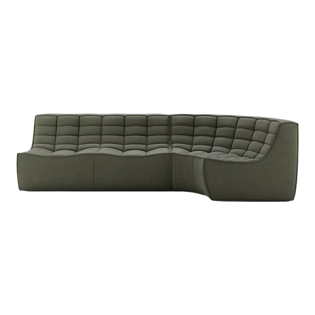 Modern green sectional sofa with tufted pattern, featuring a sleek design and soft fabric texture.