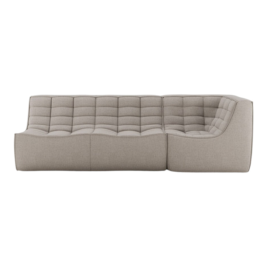 Light taupe sectional sofa with tufted design and textured upholstery for a modern, cozy look.