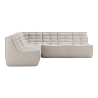 Light beige sectional sofa with tufted upholstery and smooth, modern design. Perfect for stylish living spaces.