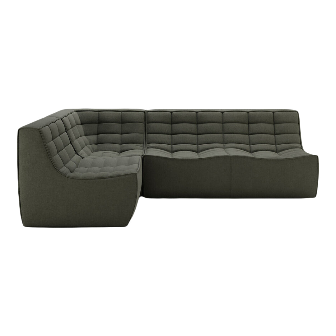 Modern dark green sectional sofa with tufted design and sleek lines for a sophisticated style.