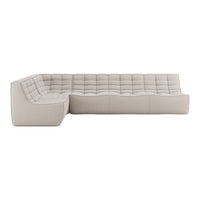 Beige sectional sofa with a tufted design and textured fabric, perfect for modern living spaces.