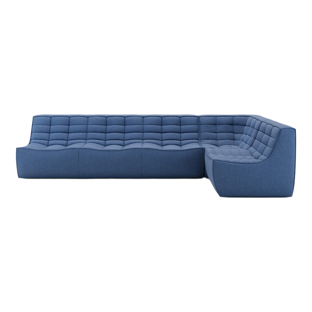 Blue tufted sectional sofa with a sleek design and textured fabric in various shades of blue.