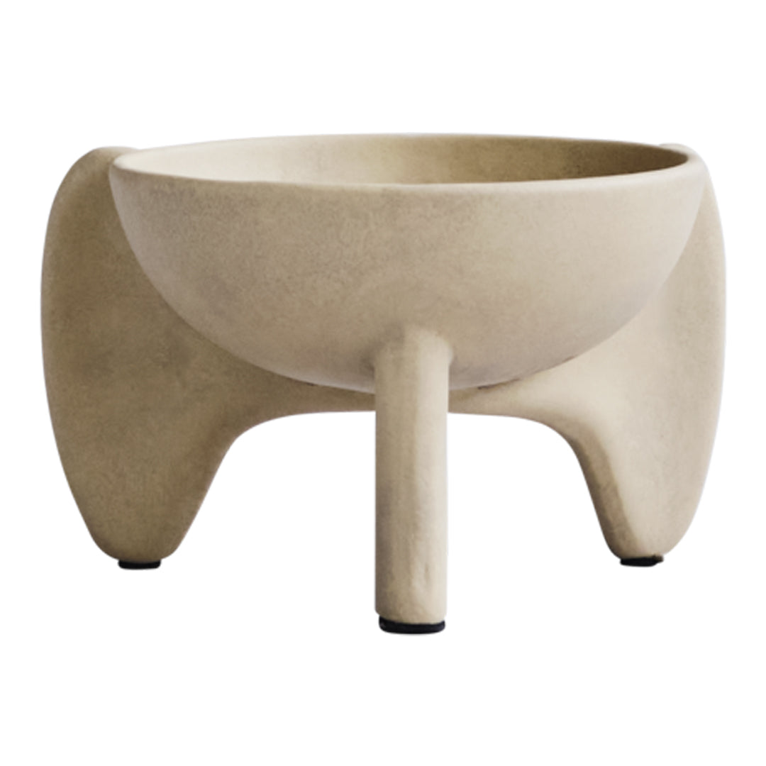 Minimalist beige bowl planter with smooth texture and rounded edges, featuring a unique three-legged design.
