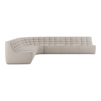 Light beige sectional sofa with tufted pattern, offering modern elegance and versatility for any living space.