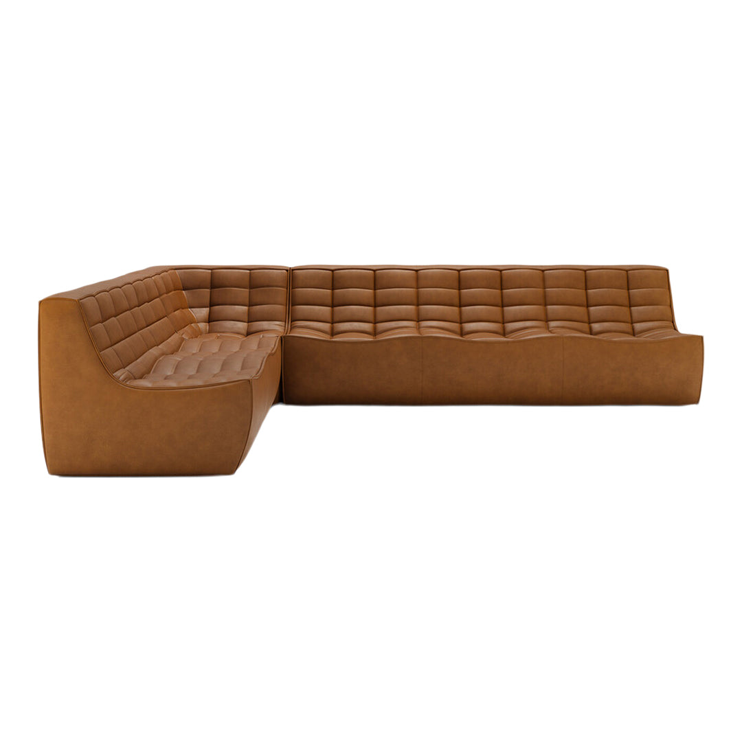 Brown leather sectional sofa with quilted pattern and smooth, contemporary design. Perfect for modern living spaces.