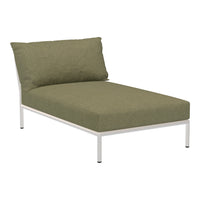Green upholstered lounge chair with a white metal frame, featuring a textured fabric pattern.
