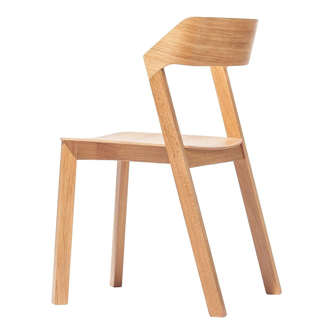 Light wood chair featuring a smooth, natural finish with minimalist lines and a sleek design.