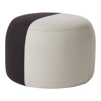 Modern round pouf featuring a two-tone design in soft beige and deep black. Perfect for chic decor.
