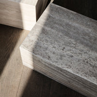 Light gray textured surface with soft patterns against a warm wooden backdrop. Ideal for modern decor.
