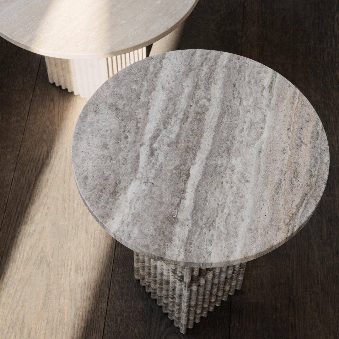 Round, textured gray marble tabletop featuring subtle light and dark veining patterns. Elegant and modern design.