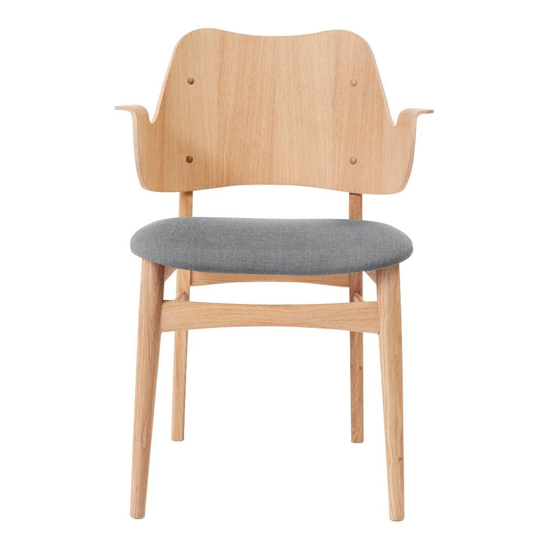 Light wood dining chair with a curved back and grey upholstered seat, showcasing a minimalist design.