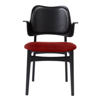 Black armchair with red upholstery, sleek design and minimalistic style, perfect for modern interiors.