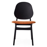 Black wooden chair with a round back and a warm, orange suede seat. Modern design, sleek lines, and vibrant color contrast.