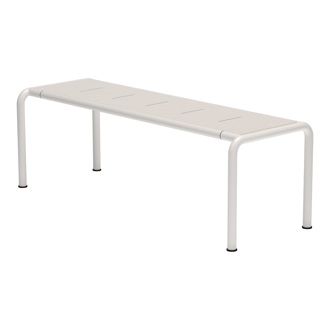 White metal bench with a sleek, minimalistic design and horizontal slat pattern, perfect for modern outdoor spaces.